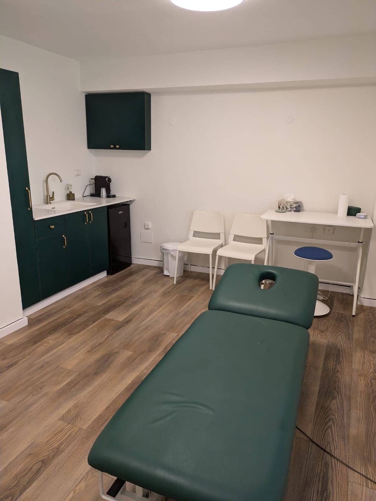 Treatment room at Israel Chiropractic Center — adjustment table and consultation area